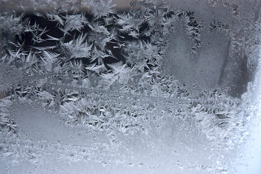 View of  frost on  glass window. Image with shallow depth of field.