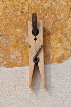Clothespin or clothes peg spring loaded wood clamp