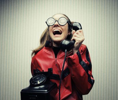 funny nerd humor woman talking retro vintage black telephone on vintage wallpaper