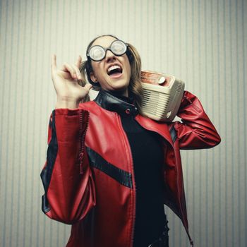 Nerdy woman listening to music, rock lover