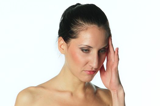 Portrait of the young and beautiful girl which the head is ill