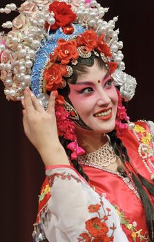 Pretty chinese opera actress with traditional costume