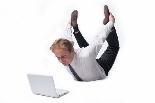 Young businessman yoga before an open notebook