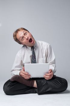 Young businessman yoga before an open notebook