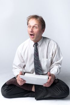 Young businessman yoga before an open notebook