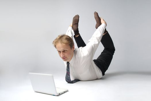 Young businessman yoga before an open notebook
