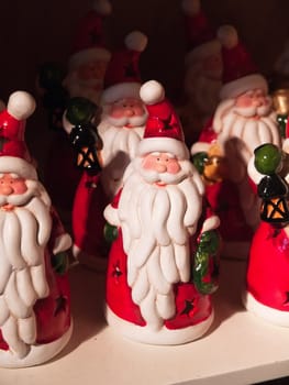 Santa Claus figurines for sale in a shop to Christmas