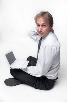Portrait of middle-aged man with a white laptop computer