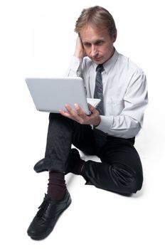 Portrait of middle-aged man with a white laptop computer