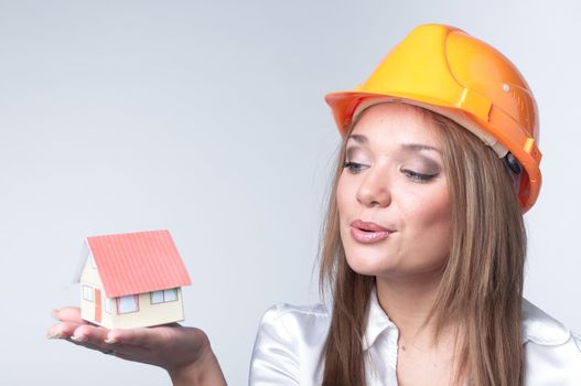 Little House in the hands of young and beautiful business woman