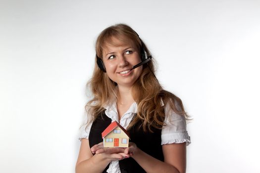 Little House in the hands of young and beautiful business woman