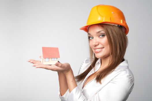 Little House in the hands of young and beautiful business woman
