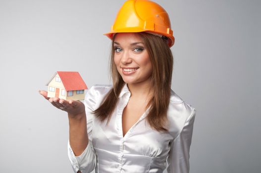 Little House in the hands of young and beautiful business woman