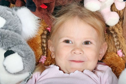 portrait of a little girl with toys