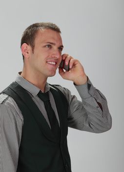 Portrait of a handsome young man on the phone.