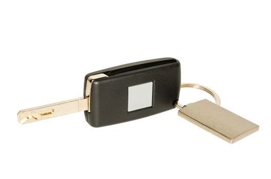 Isolated on white folding automobile key with blank plate nameplate and keychain