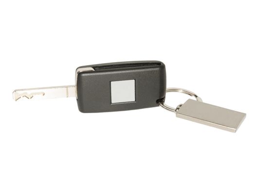 Folding car key with blank plate and nameplate isolated on white background