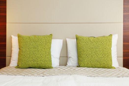 hotel bedroom with green pillow