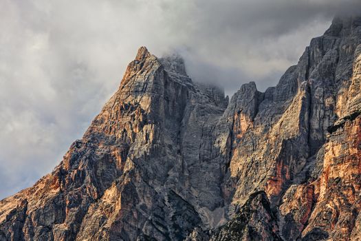 High altitude peaks and clouds in Dolomites Mountains in Italy.