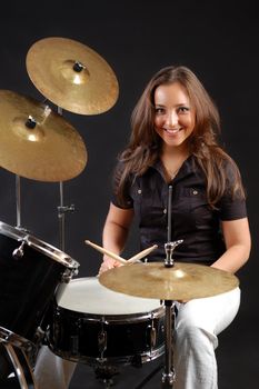 Beautiful student on the drums lesson.