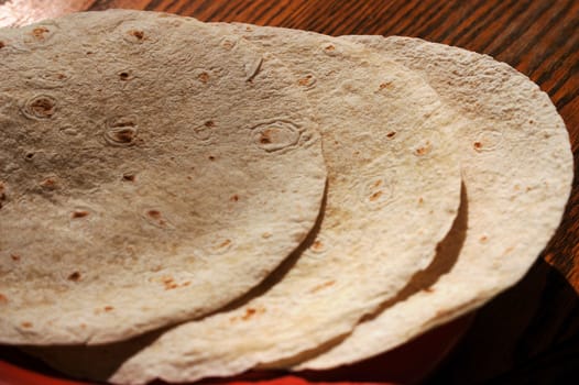 tortilla shells on a table ready for filling