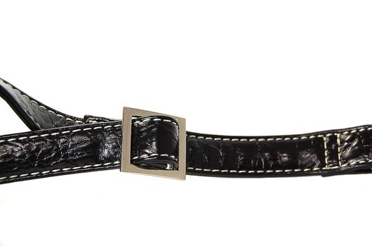 Buckle of a black leather bag isolated on white
