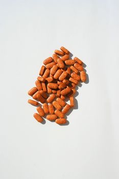 Close up of pills on a white background.
