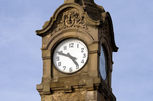 Historic clock showing ten minutes to five