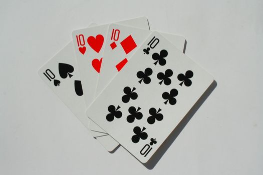 Close up of four tens on a white background.
