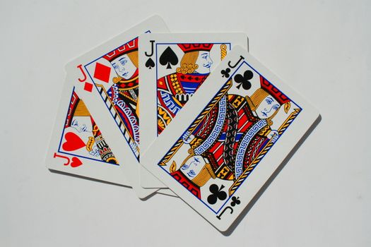 Close up of four jokers on a white background.
