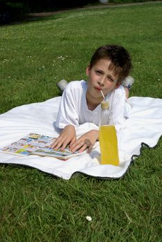 Reading a cartoon in the park.