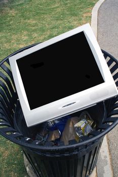 Television or Monitor laying in a trash can