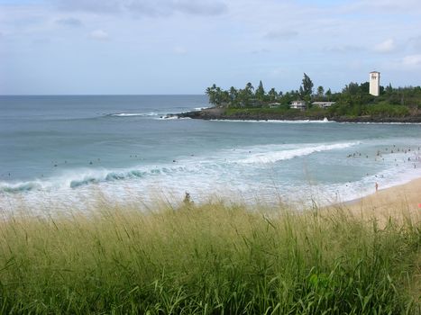 Surfers at Waimea Bay, North Shore, Oahu, Hawaii