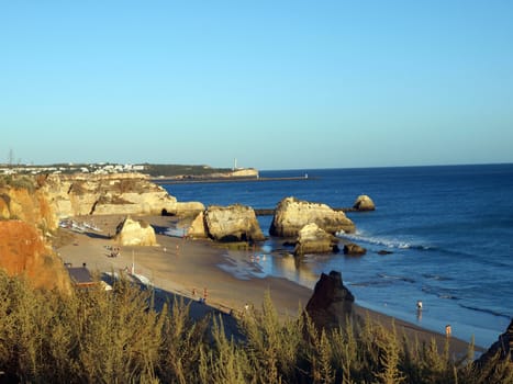 A section of the idyllic Praia de Rocha beach on the southern coast of the Portuguese Algarve region. 
