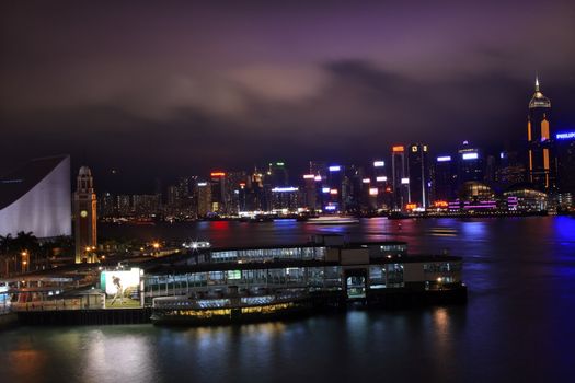Hong Kong Harbor Clock Tower at Night  With Trademarks May 8, 2011 Kowloon Star Ferry Reflection