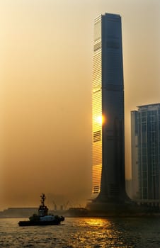 Inernational Commerce Center ICC Building Kowloon Hong Kong Harbor Tugboat, Sunset 4th Largest Building in the World