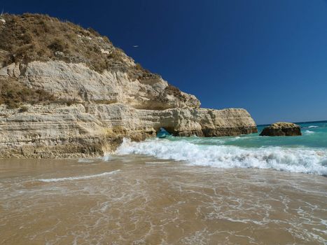 A section of the idyllic Praia de Rocha beach on the southern coast of the Portuguese Algarve region.