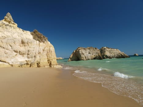 A section of the idyllic Praia de Rocha beach on the southern coast of the Portuguese Algarve region.
