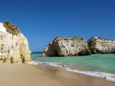 A section of the idyllic Praia de Rocha beach on the southern coast of the Portuguese Algarve region.