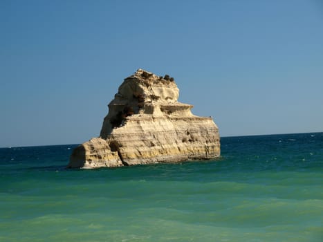 A lonely rock in the ocean. The effect of erosion