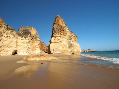 A section of the idyllic Praia de Rocha beach on the southern coast of the Portuguese Algarve region.