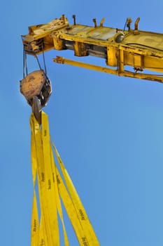 yellow mobile crane lifting
