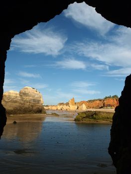 Caves and colourful rock formations on the Algarve coast in Portugal