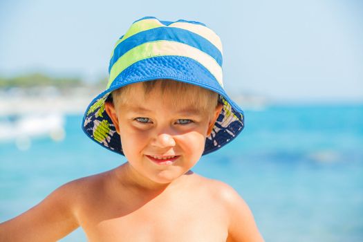 People series: portarit of boy on summer sea beach