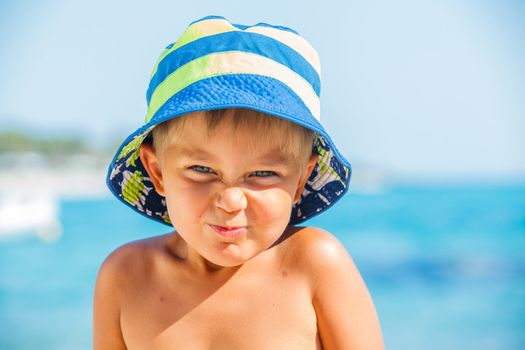 People series: portarit of boy on summer sea beach