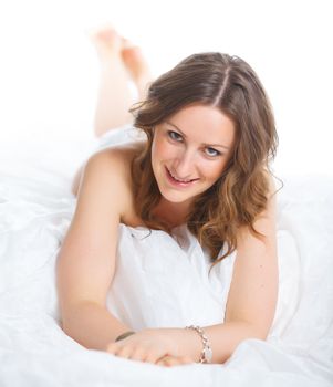 Portrait of beautiful young woman lying on the floor