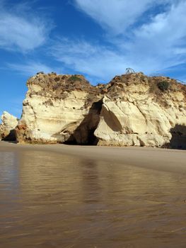 Caves and colourful rock formations on the Algarve coast in Portugal 