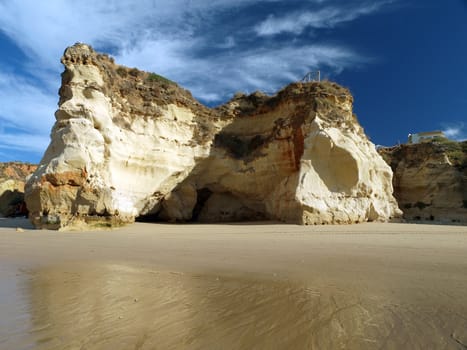 Caves and colourful rock formations on the Algarve coast in Portugal 
