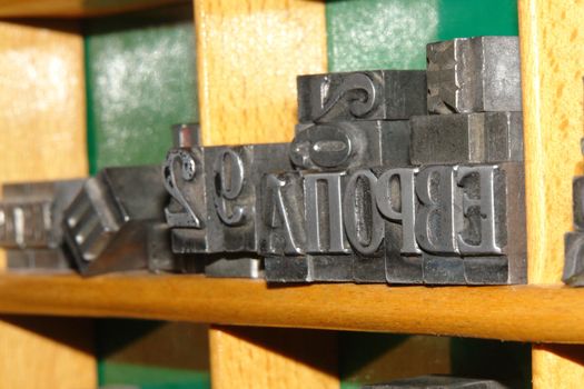 Typography letters shelf. old metallic letters for printing