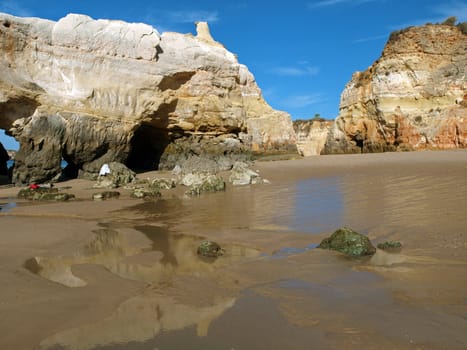 Caves and colourful rock formations on the Algarve coast in Portugal